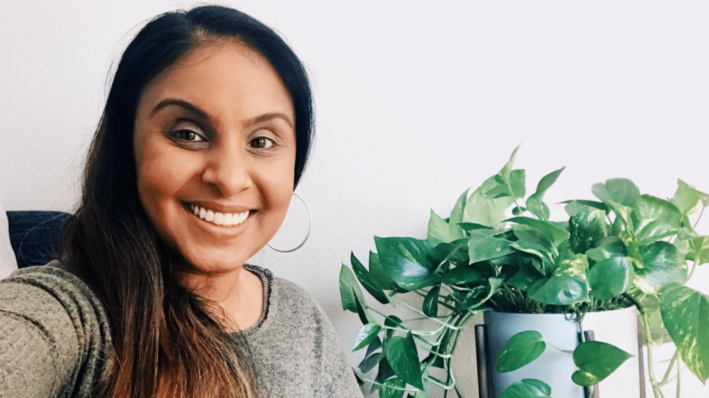 Woman posing with plant